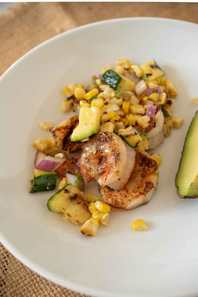 Grilled shrimp and corn salad on a plate