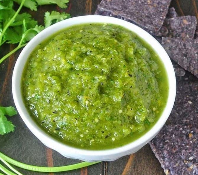 This grilled salsa verde is not your average salsa verde. Grilled tomatillos, pasilla peppers and jalapeño with added sweetness from pineapple. This  is a salsa so full of flavor you'll find it hard to put down the tortilla chips.