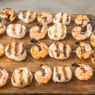 Grilled shrimp and scallop kebobs, lightly seasoned and skewered, the perfect summer dish.