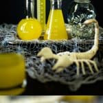Halloween scorpion venom punch is the most fun and spooky Halloween drink.  Lemon jello adds a bright hue to this drink along with pineapple juice and optional vodka make this drink perfect for adults and children that will put the 'sting' into your Halloween party.