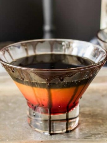 Halloween spooky screwdriver is a fun adult cocktail for everyone's favorite scary holiday with a mocktail option so no one is left out of the frightening fun. Layers of grenadine, orange juice and black colored vodka.