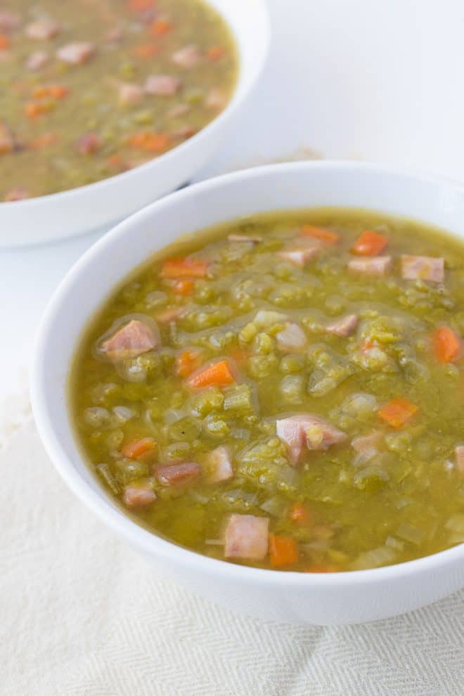 A white bowl of Split Pea and Ham Soup
