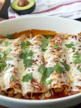5 enchiladas in an oval baking dish