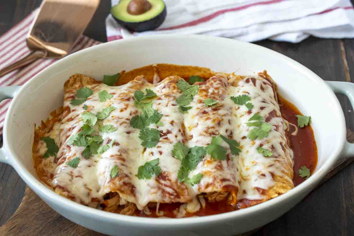 5 enchiladas in an oval baking dish
