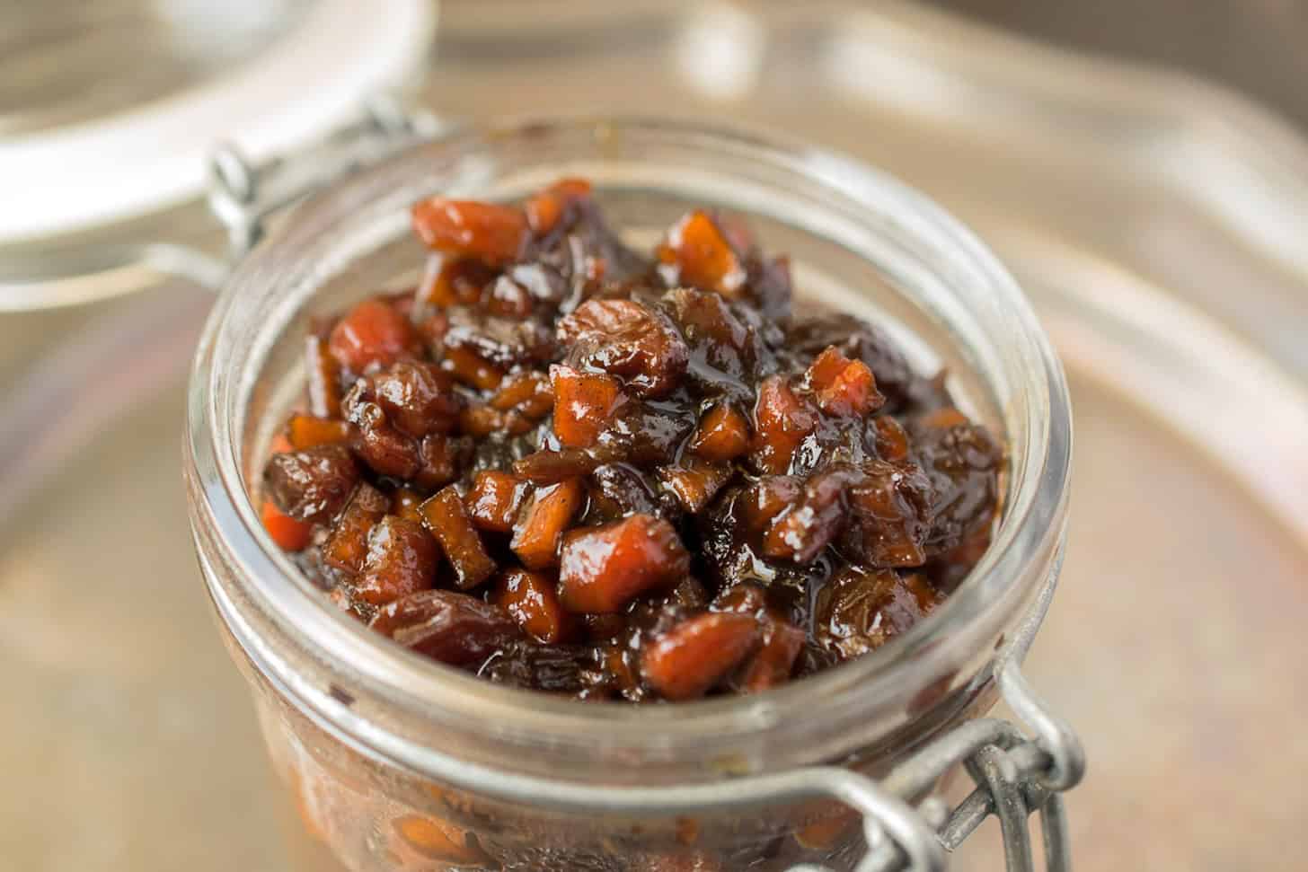 A closeup of English vegetable chutney in a jar