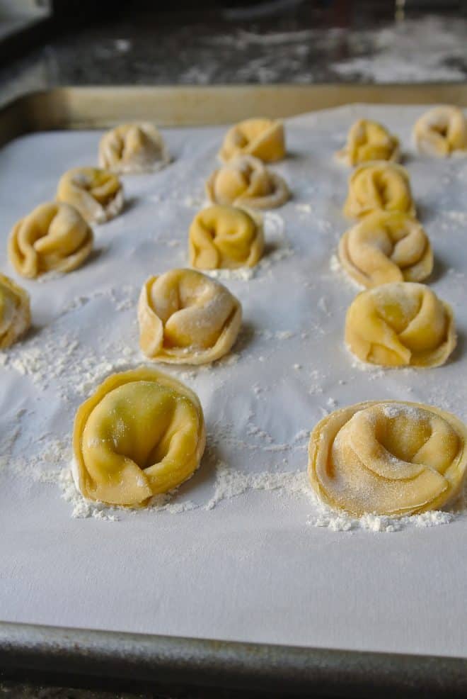 A large pan with homemade cheese tortellini ready to be cooked