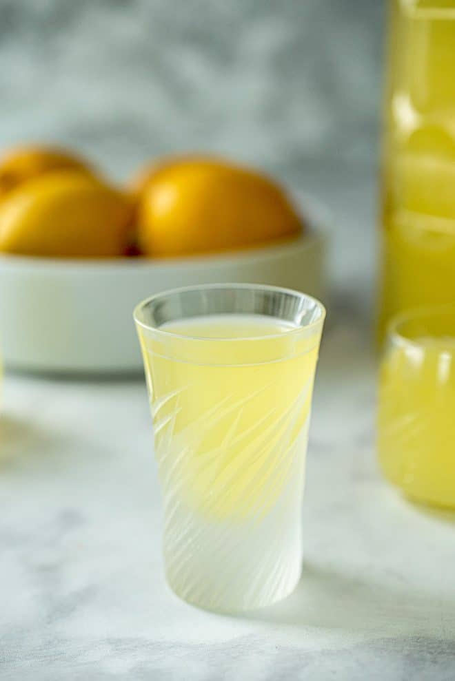 A beautiful crystal glass filled with limoncello