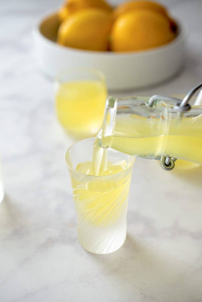 Pouring limoncello into a glass