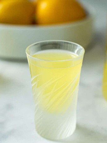 Small glasses of homemade limoncello