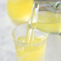 Pouring limoncello into a shot glass