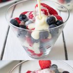 2 glass bowls of fresh berries with custard