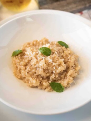 Fresh basil leaves garnishing risotto