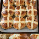 A tray of hot cross buns and a closeup
