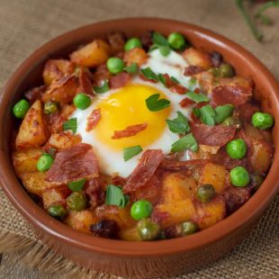 Potatoes, chorizo and peas cooked in a tomato sauce topped with an egg