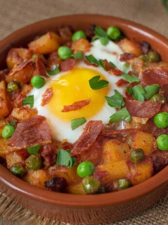 Potatoes, chorizo and peas cooked in a tomato sauce topped with an egg