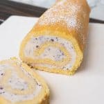 Blueberry and strawberry swirled ice cream rolled in a yellow sponge cake