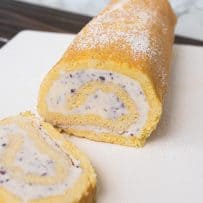 Blueberry and strawberry swirled ice cream rolled in a yellow sponge cake