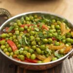 A bowl of peas and vegetables