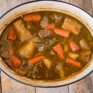 Irish beef and Guinness stew in a large Dutch oven pan