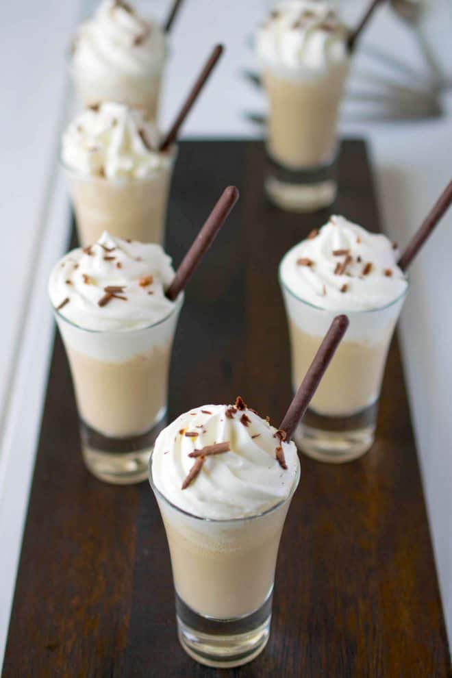 6 servings of Irish coffee milkshake shooters on a serving board