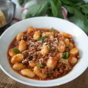 Chunky meat in tomato sauce mixed with gnocchi