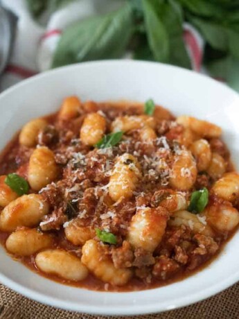 Chunky meat in tomato sauce mixed with gnocchi