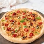 A yeast free pizza on a serving board