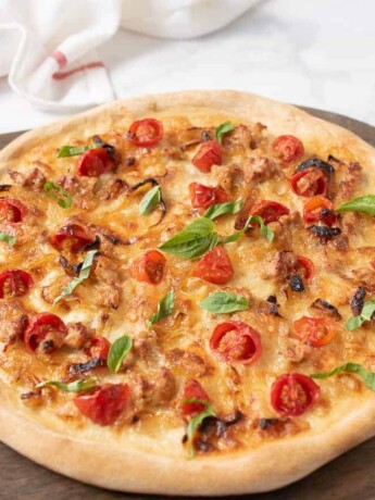 A yeast free pizza on a serving board