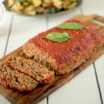 Italian meatloaf coated with pasta sauce