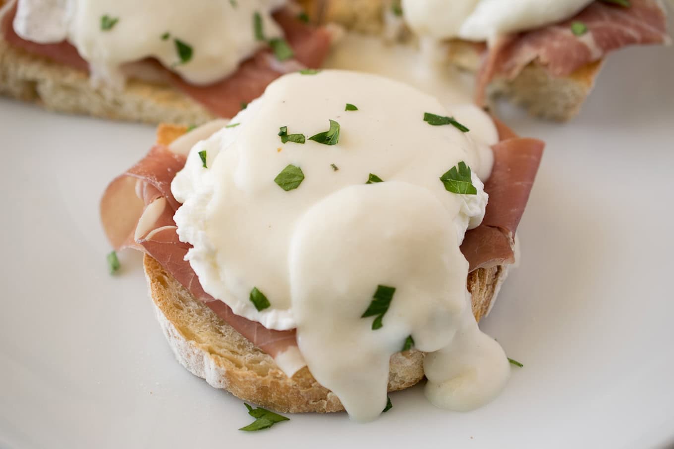 A closeup of Italian eggs benedict