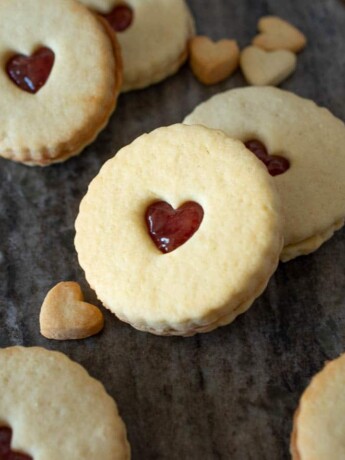 Shortbread cookies with hear cutouts filled with jam