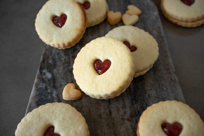 Shortbread cookies with hear cutouts filled with jam