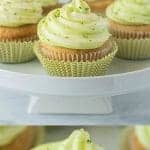 Key lime cupcakes on a white cake stand