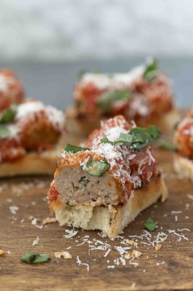 Showing the inside of a meatball on a crostini