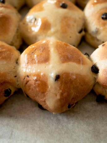 A closeup of lemon hot cross buns