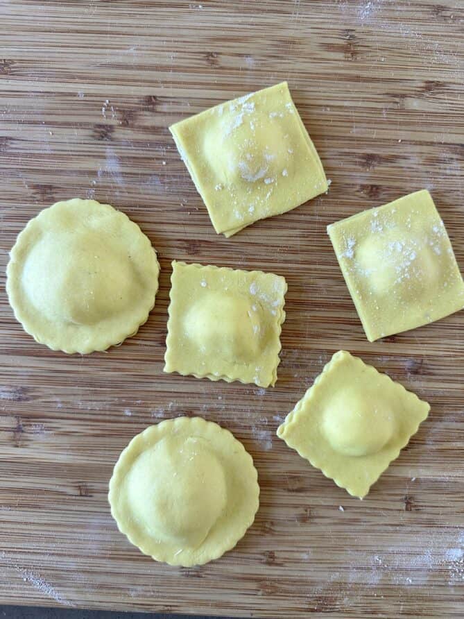 Freshly made ravioli in various shapes, round and square