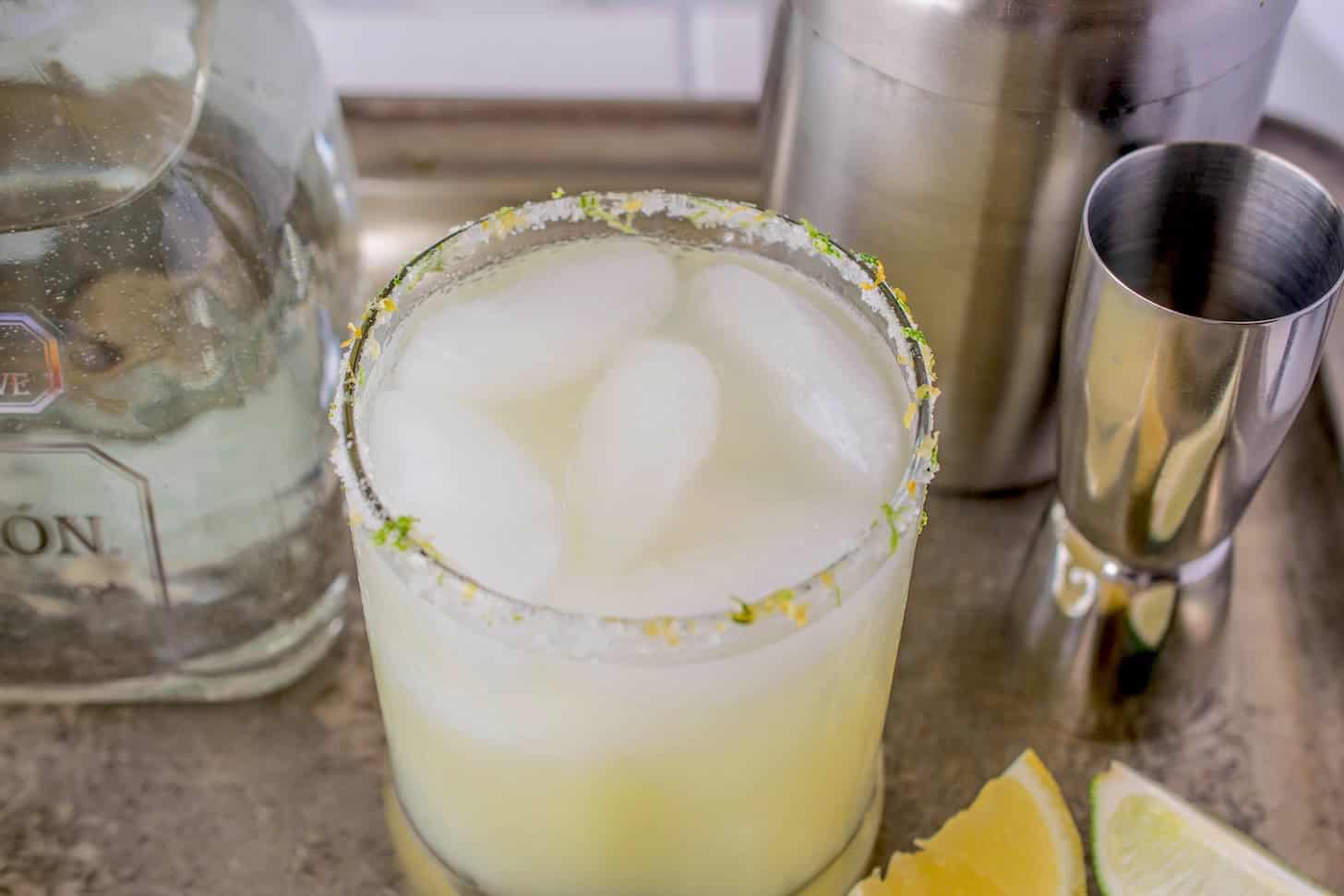 A margarita with a zested rimmed glass