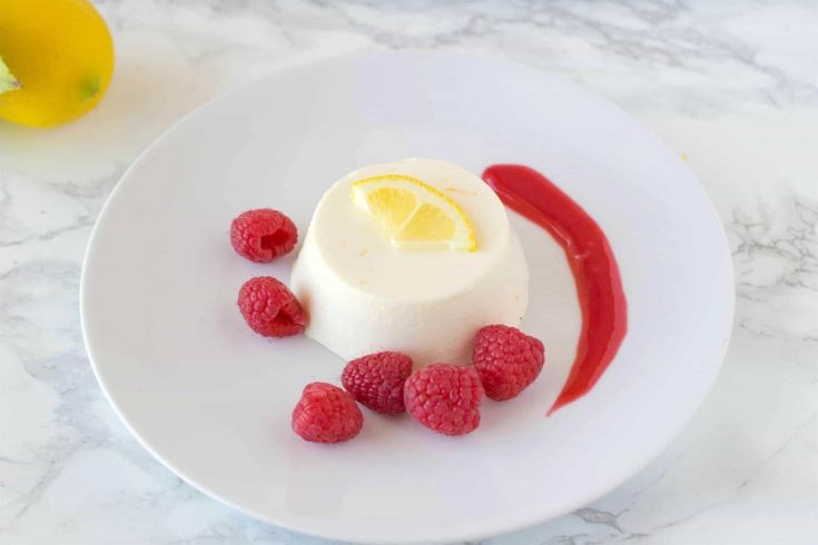 Lemon panna cotta with raspberry sauce. Creamy and sweet, this is an easy dessert that can be made ahead, refrigerate then serve when you're ready for dessert.