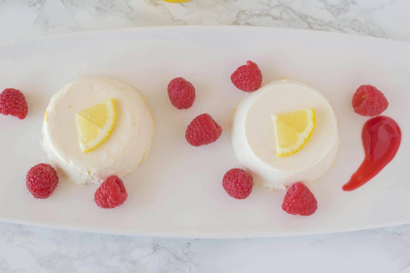 Lemon panna cotta with raspberry sauce. Creamy and sweet, this is an easy dessert that can be made ahead, refrigerated and served when you're ready for dessert.