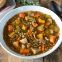 A colorful array of vegetables mixed into lentil soup