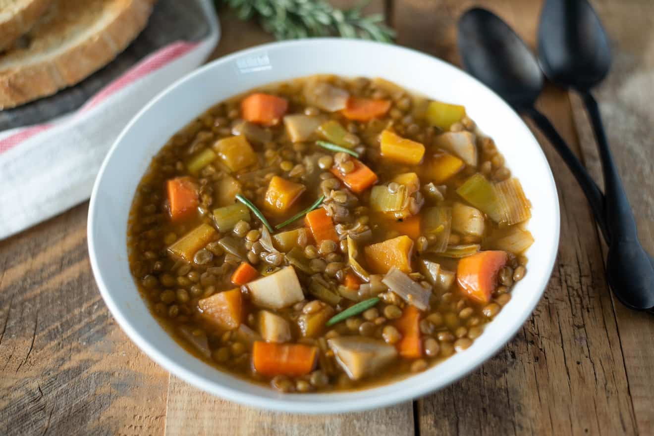 A colorful array of vegetables mixed into lentil soup