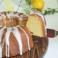 A slice of limoncello pound cake on a cake server showing the inside