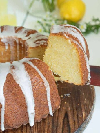 A slice of limoncello pound cake on a cake server showing the inside