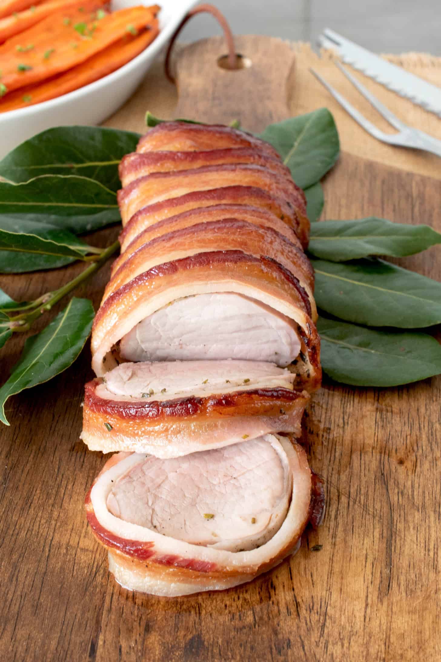 Sliced pork tenderloin wrapped in bacon
