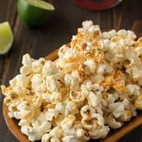 Mexican popcorn garnished with lime zest in a bowl