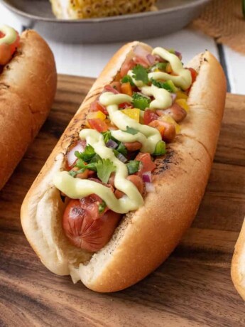 3 hot dogs on a board