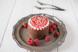 Mini chocolate cake for two is a chocolate lovers dream. Rich chocolate cake is smothered in gorgeous dark chocolate frosting with a little special decorating.