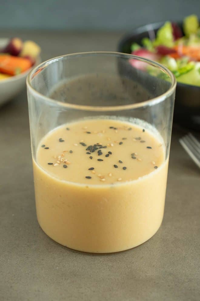 A glass container of miso dressing sauce and marinade
