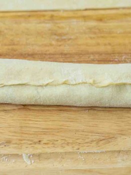 A closeup of a rolled puff pastry sealed edge