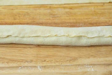 A closeup of a rolled puff pastry sealed edge